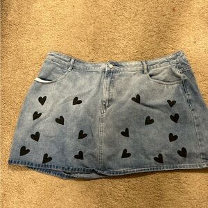 I am selling a plus size denim skirt with black hearts on it